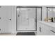 Contemporary bathroom features a glass door shower with a matte black frame at 10292 Fragrant Apple Ct, Las Vegas, NV 89141