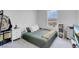 Cozy bedroom with neutral paint and carpet, a large window, and decor with room to move at 10292 Fragrant Apple Ct, Las Vegas, NV 89141