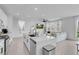 Spacious kitchen with modern design seamlessly connects to the living area at 10292 Fragrant Apple Ct, Las Vegas, NV 89141