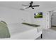 Main bedroom shows neutral paint, ceiling fan, and ensuite bathroom access at 10292 Fragrant Apple Ct, Las Vegas, NV 89141
