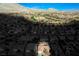 Expansive aerial view of a desert community with meticulously landscaped yards and stunning mountain backdrop at 10628 Mission Lakes Ave, Las Vegas, NV 89134