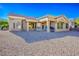 Back patio area featuring desert landscaping and plenty of space for relaxing at 10628 Mission Lakes Ave, Las Vegas, NV 89134