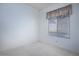 Well-lit bedroom with a window and neutral carpet at 10628 Mission Lakes Ave, Las Vegas, NV 89134