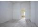 Spacious bedroom with neutral carpets, white walls and open access to a bathroom at 10628 Mission Lakes Ave, Las Vegas, NV 89134