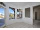 Bright breakfast nook with large windows and an elegant chandelier at 10628 Mission Lakes Ave, Las Vegas, NV 89134
