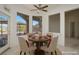 Bright breakfast nook with a round table and seating for four, complemented by views of the outdoor patio at 10628 Mission Lakes Ave, Las Vegas, NV 89134