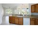 Spacious kitchen featuring granite countertops, a sink, and views of the backyard at 10628 Mission Lakes Ave, Las Vegas, NV 89134
