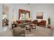 Staged living room with comfortable seating, decorative accents, and a bright, inviting atmosphere at 10628 Mission Lakes Ave, Las Vegas, NV 89134