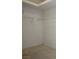 Spacious walk-in closet with bright white walls and wire racks for storage at 10628 Mission Lakes Ave, Las Vegas, NV 89134