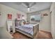 Charming bedroom featuring a cozy bed, decorative ceiling, and a bright window with natural light at 10952 Napa Ridge Dr, Las Vegas, NV 89144
