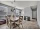 Inviting dining area with tile floors, modern lighting, and a dining table with seating for six at 10952 Napa Ridge Dr, Las Vegas, NV 89144