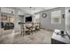 Open-concept dining area featuring tile floors, modern lighting, and dining table with seating at 10952 Napa Ridge Dr, Las Vegas, NV 89144