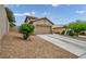 Charming single-Gathering home with desert landscaping, a two-car garage, and a concrete driveway at 10952 Napa Ridge Dr, Las Vegas, NV 89144