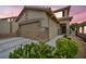 Inviting single-Gathering home featuring a two-car garage, desert landscaping, and a covered front entry at 10952 Napa Ridge Dr, Las Vegas, NV 89144