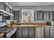 Kitchen featuring granite countertops, stainless steel appliances, and dark cabinets at 10952 Napa Ridge Dr, Las Vegas, NV 89144