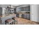 Kitchen with stainless steel appliances, breakfast bar with stools, and granite countertops at 10952 Napa Ridge Dr, Las Vegas, NV 89144