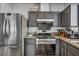 Kitchen with stainless steel appliances, granite countertops, and dark cabinetry at 10952 Napa Ridge Dr, Las Vegas, NV 89144