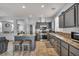 Contemporary kitchen featuring stainless steel appliances, granite countertops, and a breakfast bar with stools at 10952 Napa Ridge Dr, Las Vegas, NV 89144