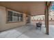 Covered patio with a seating area, perfect for enjoying the backyard view at 10952 Napa Ridge Dr, Las Vegas, NV 89144