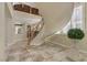 Elegant foyer with a curved staircase, tile flooring and natural lighting at 1272 Olivia Pkwy, Henderson, NV 89011