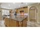 Large kitchen island, stainless steel appliances and adjacent breakfast nook at 1272 Olivia Pkwy, Henderson, NV 89011