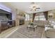 Bright living room with fireplace, TV, and comfortable seating area at 1272 Olivia Pkwy, Henderson, NV 89011