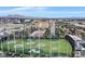 This aerial view of the property shows the putting green with views of the Las Vegas skyline at 135 E Harmon Ave # 1401, Las Vegas, NV 89109