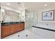 Spacious bathroom features double vanity, soaking tub, and tiled walk-in shower at 135 E Harmon Ave # 1401, Las Vegas, NV 89109