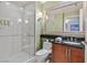 Spa-like bathroom featuring tiled walk-in shower and updated vanity at 135 E Harmon Ave # 1401, Las Vegas, NV 89109