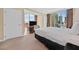 Bright bedroom features city views and comfortable furnishings at 135 E Harmon Ave # 1401, Las Vegas, NV 89109