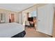 This bedroom has a large bed, a work desk, and an adjacent bathroom at 135 E Harmon Ave # 1401, Las Vegas, NV 89109