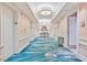 Hallway featuring elegant design, with light fixtures and luxury carpet at 135 E Harmon Ave # 1401, Las Vegas, NV 89109