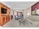 Inviting living room features a modern entertainment center and an open layout to the kitchen at 135 E Harmon Ave # 1401, Las Vegas, NV 89109