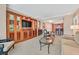 Warm living space with a flat screen TV, dining area, kitchen, and neutral decor at 135 E Harmon Ave # 1401, Las Vegas, NV 89109