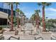 Luxury community pool area with palm trees and manicured landscaping at 135 E Harmon Ave # 1401, Las Vegas, NV 89109