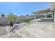 Spacious backyard featuring brick pavers, artificial turf, and a covered patio, perfect for outdoor enjoyment at 1413 Culley St, Las Vegas, NV 89110