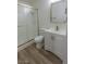 Bathroom features a glass enclosed shower and white vanity with gold hardware accents at 1413 Culley St, Las Vegas, NV 89110