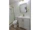 Updated bathroom features a glass shower, white vanity, and gold hardware, enhancing style at 1413 Culley St, Las Vegas, NV 89110