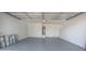 Spacious, freshly painted two car garage with epoxy floors and access door to the home at 1413 Culley St, Las Vegas, NV 89110