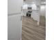 Stylish kitchen with stainless appliances, marble counters, and wood-look floors at 1413 Culley St, Las Vegas, NV 89110