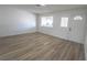 Bright living room features wood-look flooring, ample natural light, and a welcoming atmosphere at 1413 Culley St, Las Vegas, NV 89110