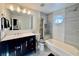 Bright bathroom boasts modern vanity, tub with shower, and stylish finishes at 1704 Cordoba Canyon St, Las Vegas, NV 89117