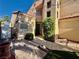 Inviting front of house features a tiled entry and lush landscaping at 1704 Cordoba Canyon St, Las Vegas, NV 89117