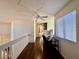 Hallway with wood floors, ceiling fan, and a desk area at 1704 Cordoba Canyon St, Las Vegas, NV 89117