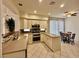 Modern kitchen with stainless steel appliances, tiled backsplash, and a cozy breakfast nook at 1704 Cordoba Canyon St, Las Vegas, NV 89117