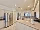 Bright kitchen features stainless steel appliances, white cabinets, and a tile backsplash at 1704 Cordoba Canyon St, Las Vegas, NV 89117