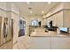 Bright kitchen features stainless steel appliances, white cabinets, and a tile backsplash at 1704 Cordoba Canyon St, Las Vegas, NV 89117