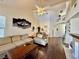 Inviting living room with hardwood floors, high ceilings, and a view of the second-floor balcony at 1704 Cordoba Canyon St, Las Vegas, NV 89117