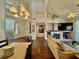 Bright living space with hardwood floors, a fireplace, and an open layout to the dining area at 1704 Cordoba Canyon St, Las Vegas, NV 89117