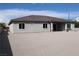 Exterior view of the house with a large backyard at 197 E Shelbourne Ave, Las Vegas, NV 89123
